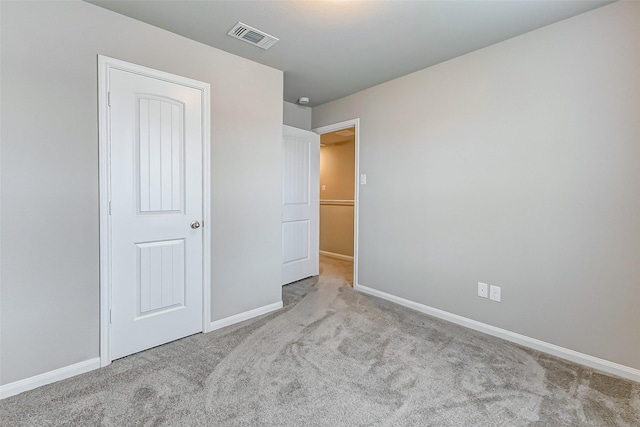 unfurnished bedroom featuring light colored carpet