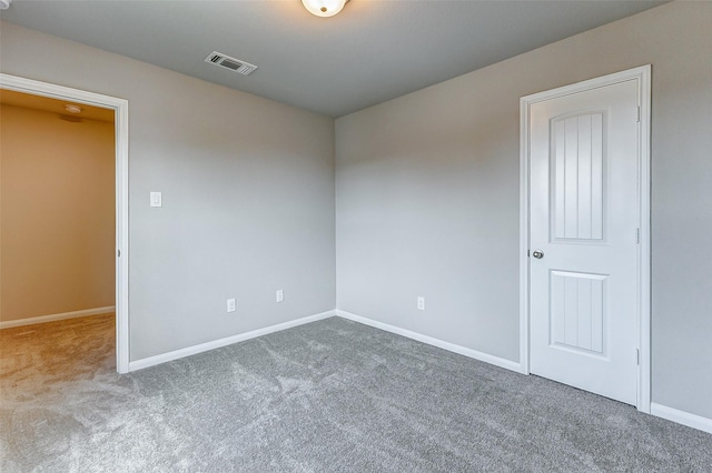 unfurnished room featuring carpet flooring