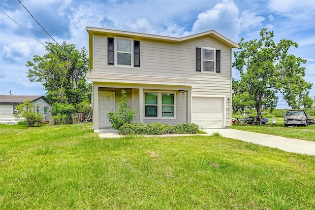 front of property featuring a front lawn and a garage