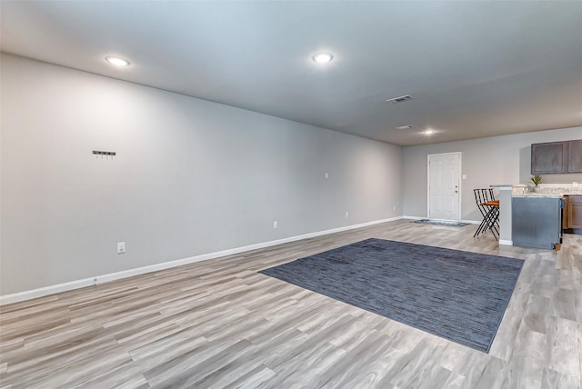 spare room featuring light hardwood / wood-style floors