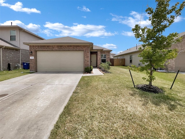 view of front of property featuring a front yard and a garage