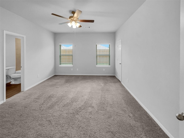 carpeted spare room with ceiling fan