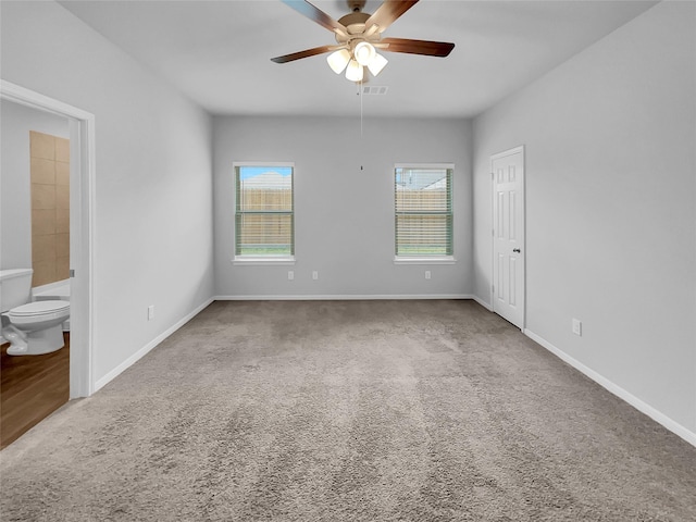 unfurnished room featuring carpet floors and ceiling fan