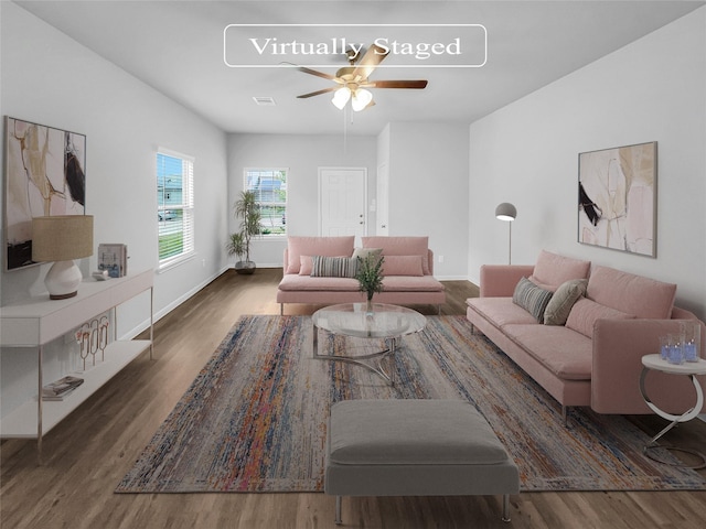 living room featuring dark hardwood / wood-style flooring and ceiling fan