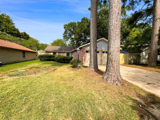 view of yard with a garage and an outdoor structure