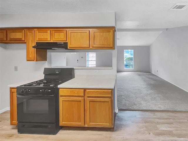 kitchen with light colored carpet and black range with gas stovetop