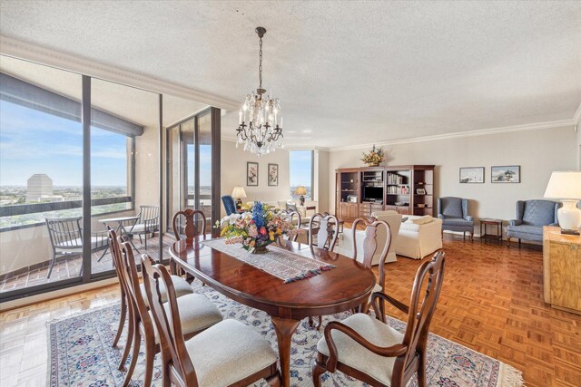 dining room featuring parquet flooring, crown molding, a textured ceiling, and a chandelier