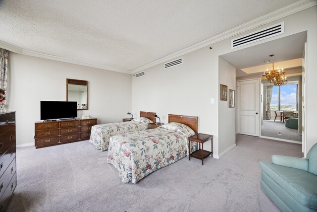 bedroom featuring a textured ceiling, carpet flooring, a chandelier, and ornamental molding