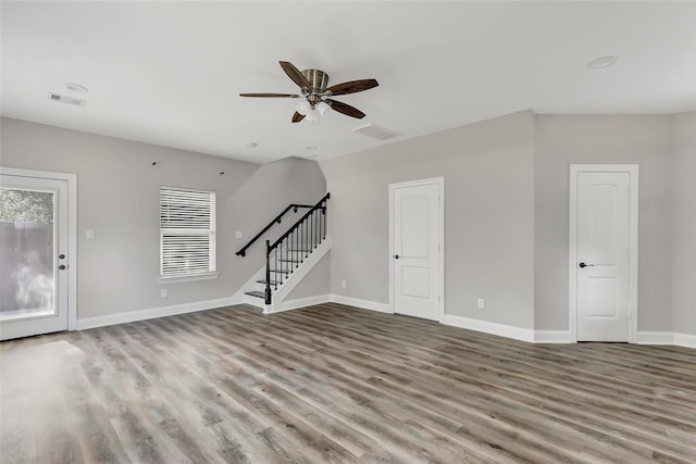 unfurnished living room featuring hardwood / wood-style floors and ceiling fan