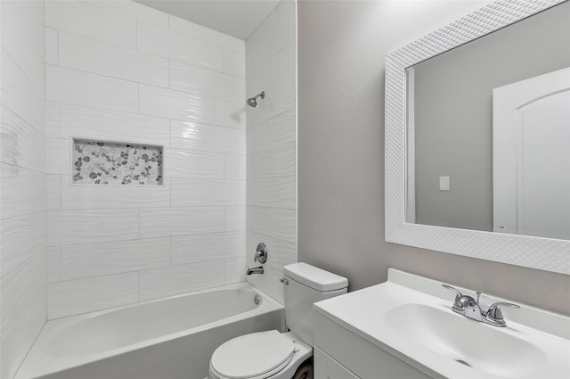 full bathroom with vanity, toilet, and tiled shower / bath