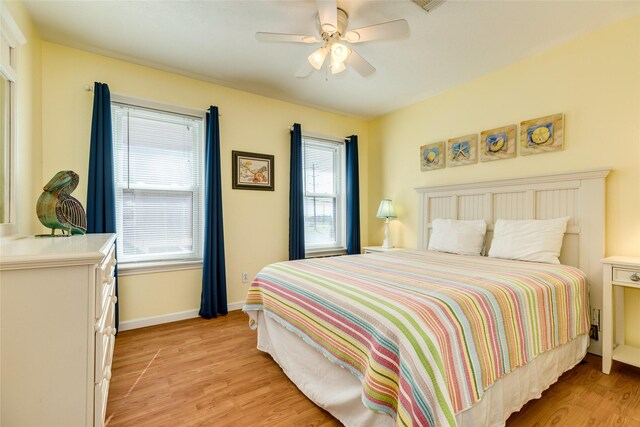 bedroom featuring ceiling fan and light hardwood / wood-style flooring