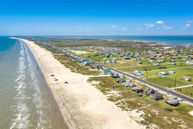 bird's eye view featuring a beach view and a water view