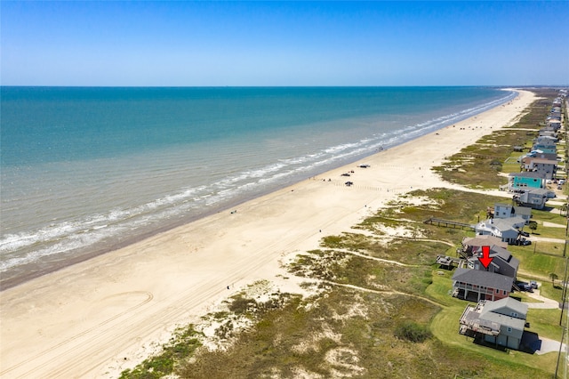 drone / aerial view with a view of the beach and a water view