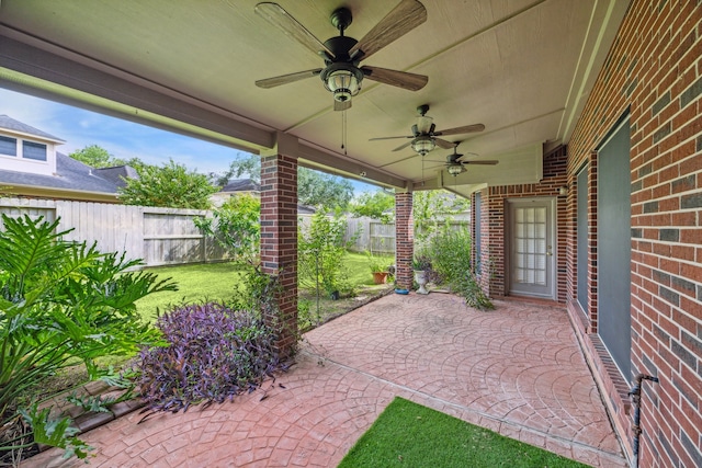 view of patio featuring ceiling fan