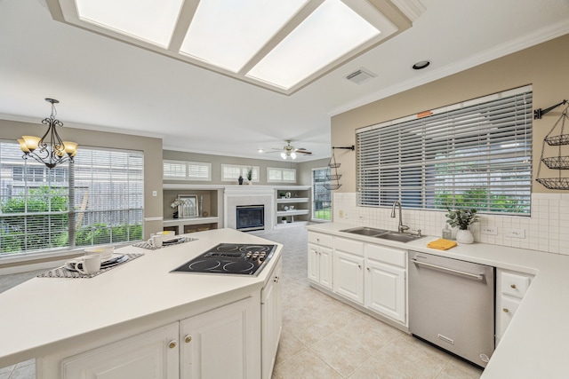 kitchen with dishwasher, backsplash, sink, and white cabinetry