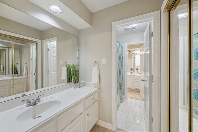 bathroom featuring tile patterned floors and vanity