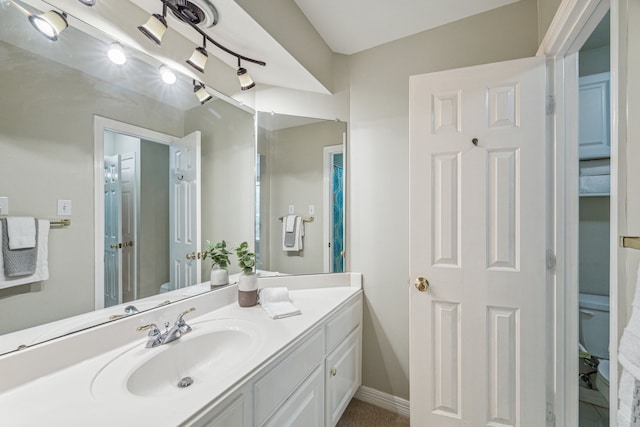 bathroom featuring vanity and toilet