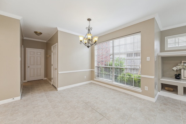 tiled spare room with ornamental molding and a chandelier