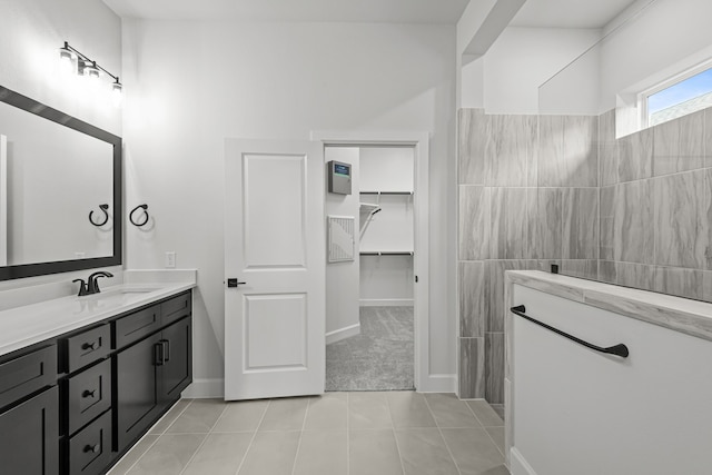 bathroom with tile patterned flooring and vanity