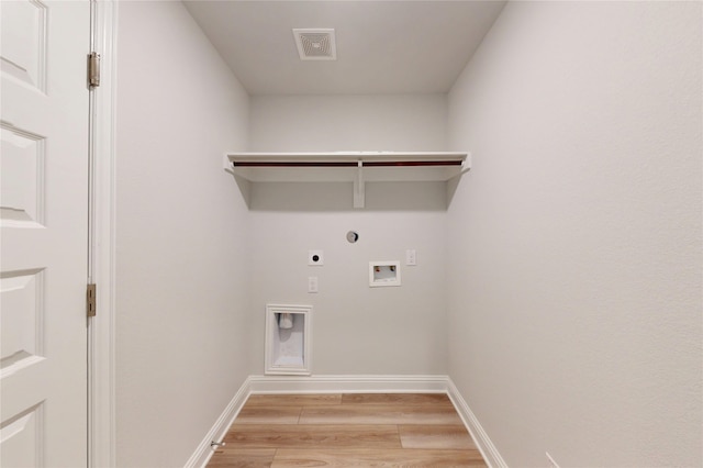 19910 Paros Island Dr, Hockley, TX 77447 - clothes washing area featuring hookup for a washing machine, visible vents, hookup for an electric dryer, laundry area, and light wood-type flooring