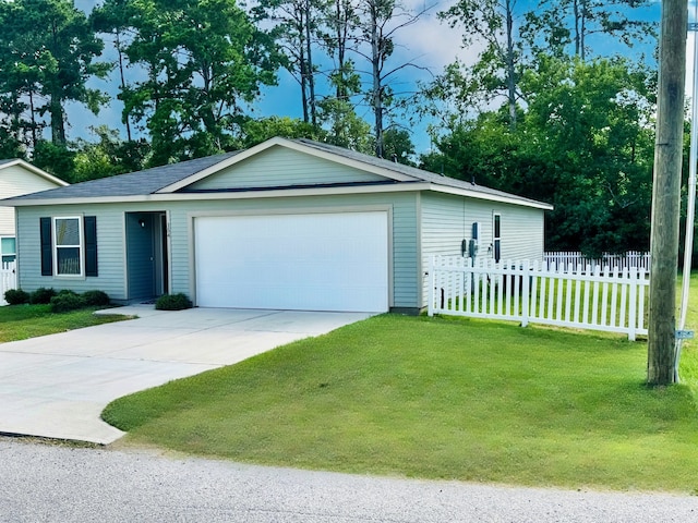 view of front of home featuring a garage and a front lawn