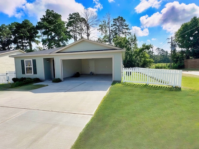 view of front of home featuring a garage and a front yard