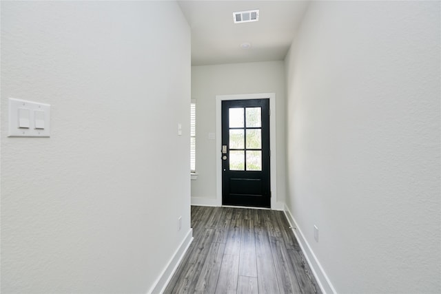 doorway to outside featuring dark hardwood / wood-style floors