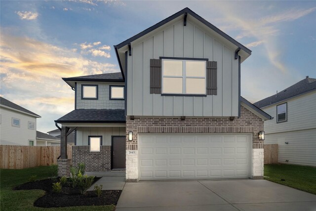 view of front facade featuring a yard and a garage