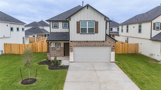 view of front of property with a front lawn and a garage