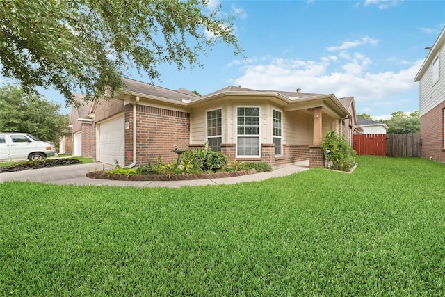 view of front of property featuring a garage and a front lawn