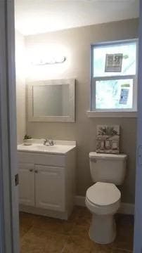 bathroom with vanity and toilet