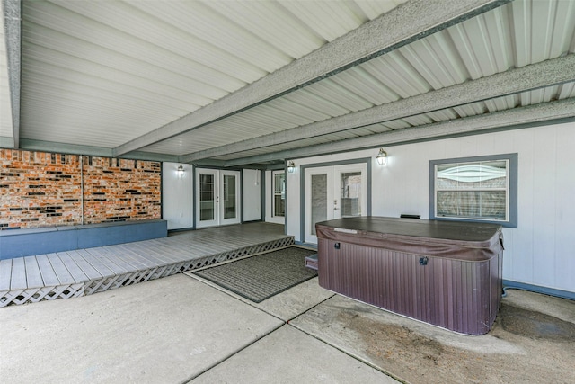 view of patio / terrace with french doors, an indoor hot tub, and a wooden deck