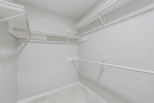 walk in closet featuring tile patterned floors