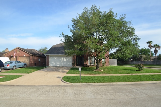 view of front of home featuring a garage and a front yard