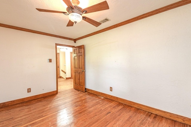 36920 Cougar Dr, Simonton, TX 77476 - unfurnished room with visible vents, ceiling fan, baseboards, ornamental molding, and light wood-style floors