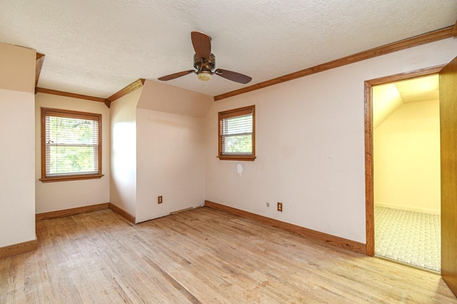 36920 Cougar Dr, Simonton, TX 77476 - spare room featuring a textured ceiling, ornamental molding, a ceiling fan, and light wood finished floors