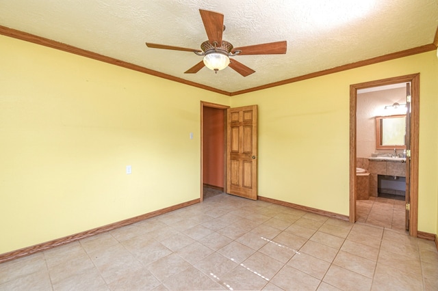 36920 Cougar Dr, Simonton, TX 77476 - empty room featuring ornamental molding, a ceiling fan, a textured ceiling, light tile patterned floors, and baseboards