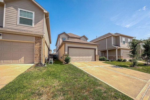 view of front of home featuring a front yard and a garage