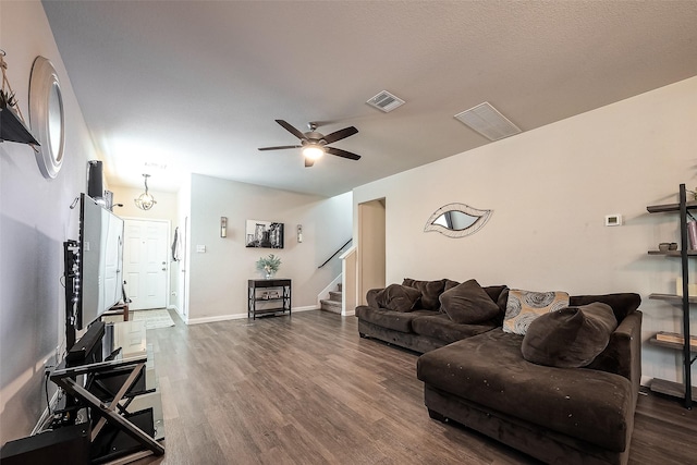 living room with dark hardwood / wood-style floors and ceiling fan