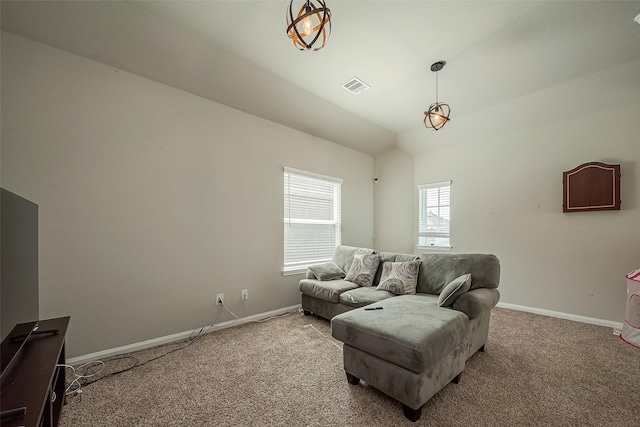 living room featuring light carpet and vaulted ceiling