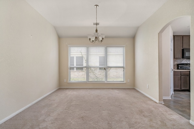 interior space with a chandelier and lofted ceiling