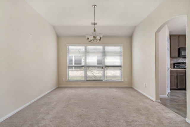 3019 Fern Brook Ln, Rosenberg, TX 77471 - unfurnished dining area with arched walkways, a chandelier, light carpet, lofted ceiling, and baseboards