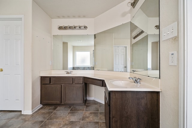 bathroom featuring tile patterned flooring and double vanity