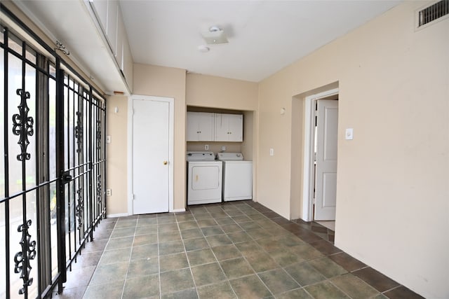 kitchen with washer and clothes dryer and tile patterned flooring