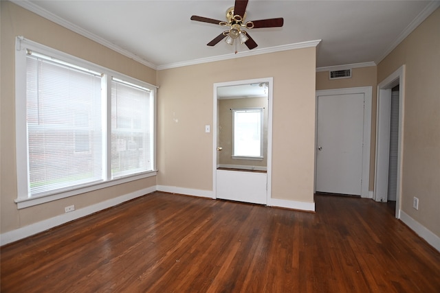 interior space with ceiling fan, dark hardwood / wood-style floors, and ornamental molding