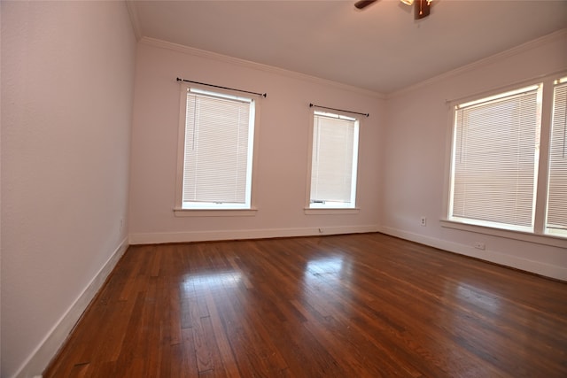 unfurnished room featuring ornamental molding, ceiling fan, and dark wood-type flooring