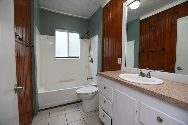 full bathroom featuring vanity, shower / bathing tub combination, toilet, a textured ceiling, and tile patterned flooring