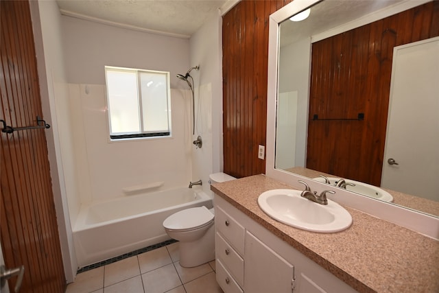 full bathroom featuring a textured ceiling, toilet, vanity,  shower combination, and tile patterned floors