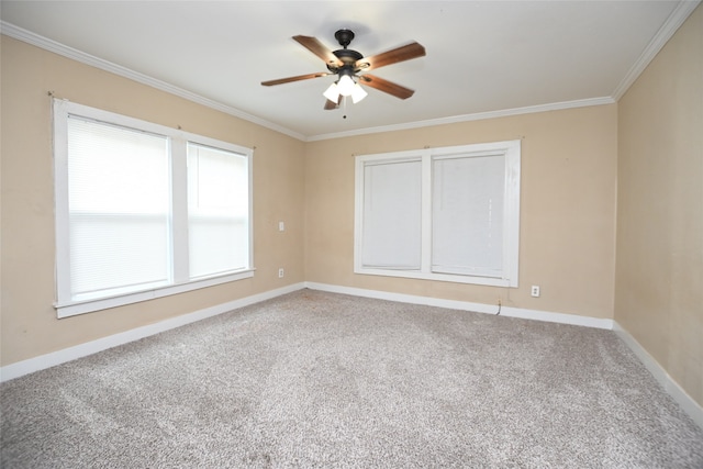 carpeted empty room featuring crown molding and ceiling fan