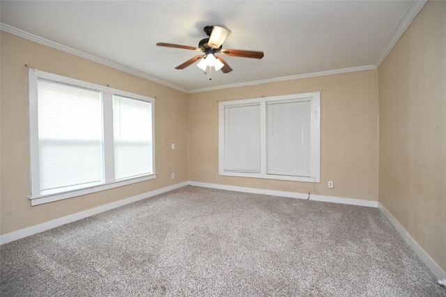 carpeted spare room featuring ornamental molding and ceiling fan